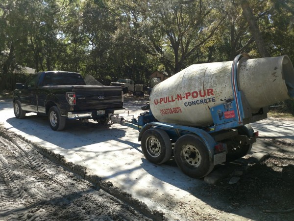 U-Pull-N-Pour branded mixer at a driveway pour
