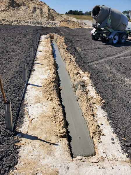 Concrete footing pour with mixer in background